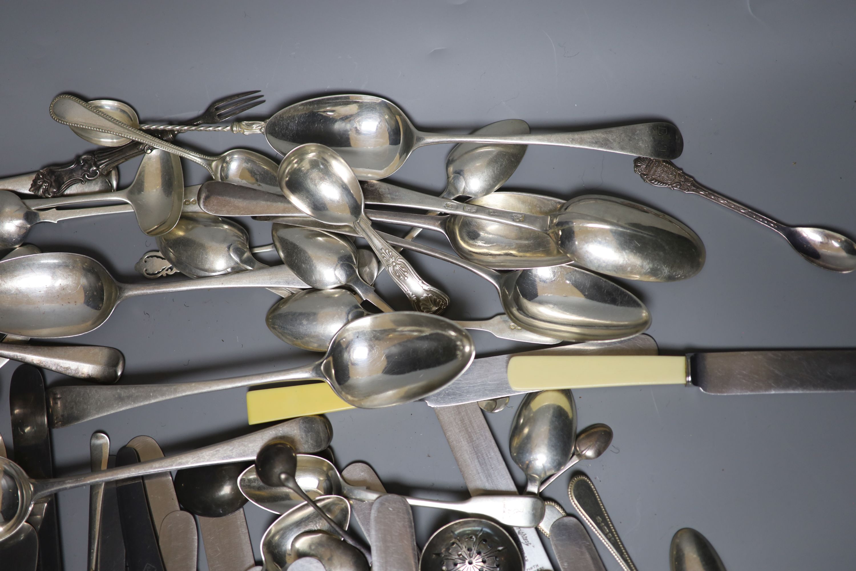 Eleven Victorian silver fiddle pattern teaspoons, a quantity of minor silver flatware, ten assorted 18th/19th century silver tablespoons, a small group of plated flatware and a group of assorted ivorine handled table and